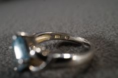 I am offering you this vintage sterling silver Art Deco style band ring with a gorgeous prong set trillion triangle shaped, genuine blue topaz stone. There is a regal influence in the design here, very nice! There is fabulous design setting. It measures app. 3/4 inch, by app. 1/4 inch. It has color saturation and intensity that is endless, as seen in the provided pictures. What an eye catcher! It has the classic highly desired solid setting that is very thick and substantial, giving this ring al Silver Topaz Birthstone Ring For Formal Occasions, Formal Trillion Cut Topaz Ring In Fine Jewelry Style, Vintage Topaz Ring With Polished Finish For Anniversary, Trillion Cut Birthstone Ring For Formal Events, Silver Trillion Cut Jewelry For Formal Events, Trillion Cut Silver Jewelry For Formal Occasions, Vintage Silver Topaz Birthstone Ring, Formal Trillion Cut Birthstone Ring, Silver Pear-shaped Topaz Promise Ring