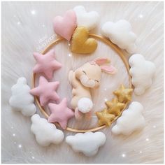 a basket filled with stuffed animals sitting on top of a white fur covered floor next to stars