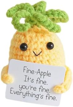 a stuffed animal holding a sign that says fine - apple it's fine, you're fine everything's fine