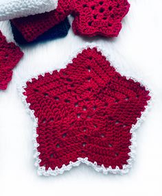 red and white crocheted dishcloths laying on top of each other