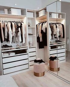 an organized closet with mirrored doors and drawers