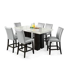 PRICES MAY VARY. White Marble, espresso finished base Gorgeous white natural marble top Spacious 70" x 40" top Stylish silver faux leather chairs Table: 70"L x 40"W x 36"H Chairs: 19"W x 26"D x 42"H Elegant dining with a modern twist, the Camila Rectangle Counter Height 7 Piece Dining Set offers a beautiful white marble top with stylish wide legs finished in a deep espresso to add to contemporary design. The silver vinyl counter height chairs are accented by stylish silver nail head trim and fea Faux Leather Chair, Counter Height Chairs, 7 Piece Dining Set, Counter Chairs, Counter Height Dining Sets, Elegant Dining, Velvet Material