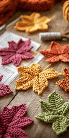 crocheted autumn leaves laid out on a table