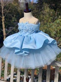 Perfect match for train lovers with an off-the-shoulder Princess look! This design of ours has a very unique style that you can't see in Etsy or other platforms! Beautiful shade of Light Sky Blue combined with a hand-beaded lace on the collar, completing the design with an off-the-shoulder type of look with a beautiful long train on the back. A puffy, tulle skirt underneath gives a big volume to the dress. It will make your little princess so happy in her special day! Comes with FREE matching he Hand Beaded Lace, 1st Birthday Tutu, Sky Blue Dress, Light Sky Blue, Girls Blue Dress, Marine Uniform, Mid Calf Dresses, Kids Couture, Dress Princess