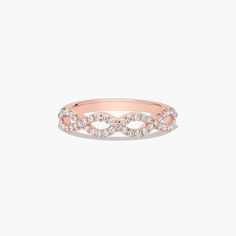 a rose gold ring with diamonds on it