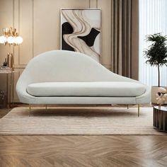 a living room with a white couch and wooden floors