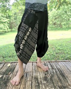 a person standing on top of a wooden deck