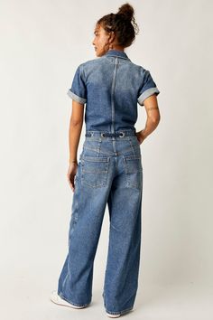 An updated classic... The Edison Wide Leg Coverall is a flattering denim jumpsuit you'll wear season after season. This workwear-inspired jumpsuit offers a comfortable, relaxed fit with a flattering cinched waistband, plus a wide leg silhouette and the perfect utility-style details. Features: Women's short sleeve denim coveralls Relaxed, wide-leg fit Cinched waistband detail Rigid, non-stretch denim Front button closure Collared neckline Adjustable drawstring waist Oversized workwear pockets We Fly Girls, Sporty Sneakers, Bedding Brands, Fashion 2024, Midi Maxi Dress, Denim Jumpsuit, Sweater Set, Ballet Flat, Long Blouse