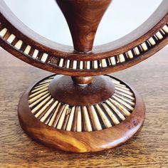 a wooden table topped with a mirror on top of a hard wood floored surface