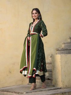 This is a beautiful 3-piece set. The set comes with hand work & gota detailing kurta has round neck, calf length and 3/4th sleeves teamed with trouser pants and a tie-dye organza dupatta. Total No of Set-3 Kurta Fabric: Chanderi Bottom Fabric - Chanderi Dupatta Fabric-Organza Work Done - Hand work & gota detailing. Sleeve Length: 3/4th Sleeves Neck: Round Neck Style: Anarkali set Color: Green Occasion: Party Wear Washing Instructions: Hand Wash or Dry Clean Chanderi Suit, Chanderi Dupatta, Chanderi Suits, Special Dresses, Organza Dupatta, Hand Work, Green Print, Trouser Pants, Indian Wear