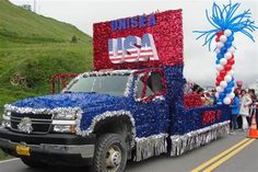 a large truck decorated with red, white and blue decorations