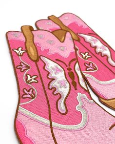 Feminine and fun pink boots featuring hearts, butterflies, and flowers give off horse girl princess vibes. This patch would pair great with the Howdy patch! Large 9" x 8.5" backpatch Iron-on backing 100% embroidered design Features glittery silver thread! Intricate heat-cut shape Large patches may need to be reinforced, especially over time. This can be done with spot stitching or fabric glue at corners, or anywhere adhesion has become undone. By Wildflower + Co. Pink Embroidered Spring Boots, Pink Embroidered Boots For Spring, Hearts Butterflies, Pink Cowgirl Boots, Princess Vibes, Pink Cowgirl, Butterflies And Flowers, Pink Boots, Fabric Glue