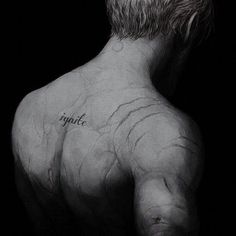 the back of a man's torso with writing on it