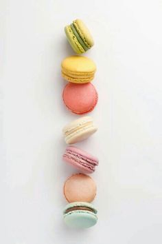 four macaroons are arranged in the shape of a spiral