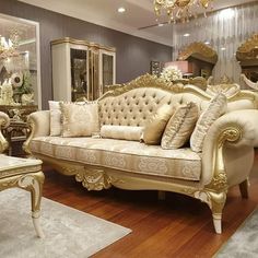 a living room filled with furniture and a chandelier