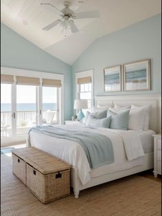 a bedroom with blue walls and white bedding