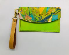 Handcrafted leather wristlet: sleek, durable, and stylish. Perfect for everyday use. Green Wristlet With Wrist Strap For Everyday Use, Green Wristlet For Everyday Use, Adjustable Green Rectangular Wristlet, Green Adjustable Rectangular Wristlet, Green Trendy Wristlet For Everyday Use, Trendy Green Wristlet For Everyday Use, Trendy Green Rectangular Wristlet, Everyday Green Rectangular Wristlet, Leather Wristlet