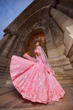 This lehenha set features geometric cut sequin in peaches and pinks in an abstract pattern. It is paired with an embroidered strappy blouse and a matching net dupatta..From Seema Gujral's Love Notes From Paris Collection DELIVERY TIMEPlease allow 8-12 weeks for your outfit to arrive. FABRIC DETAILSNet Professional cleaning only. Indian Wedding Lehenga Bridal Pink, Unique Mehendi Outfits For Bride, Pink Sequin Lehenga, American Indian Dress, Mehendi Outfits For Bride, Rekha Saree, Strappy Blouse, Peach Lehenga, Sequin Lehenga