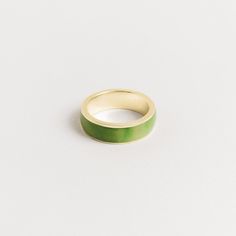 Introducing our 7mm men's inlay band, crafted with the finest green jade. This exquisite ring is a testament to the natural beauty of the stone and the stunning shades of green that jade is known for. We take great pride in sourcing our jade directly from the family that mines it, ensuring that every piece is of the highest quality and ethically sourced. The green jade is expertly cut and polished, then set into the band with precision and care. Our 7mm width is our most popular option, providin Jade Wedding Rings For Men, Green Enamel Ring With Polished Finish For Anniversary, Formal Green Enamel Ring With Polished Finish, Elegant Green Enamel Ring With Polished Finish, Minimalist Green Emerald Ring With Polished Finish, Classic Green Band Jewelry, Modern Green Round Band Jewelry, Modern Green Ring For Promise, Classic Green Round Band Ring