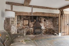 an old living room with wood burning stove