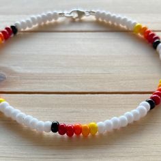 White Anklets With Colorful Beads As A Gift, Colorful Beaded White Anklets As Gift, White Anklets With Colorful Beads For Gift, White Beaded Anklets With Round Beads, Adjustable White Anklets With Colorful Beads, Casual White Round Bead Anklets, White Tiny Beads Anklets For Festival, White Beaded Festival Anklets, White Beaded Anklets For Festival