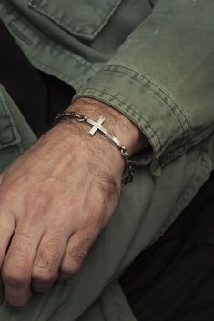 "I designed this sleek and modern cross bracelet with the cross slightly concave, to  comfortably conform and hug the wrist.  Handcrafted from 925 sterling silver, it  features my classic technique of brushing the silver and then adding a black oxide  finish to add depth and reflection. A high-end jewelry piece ideal for a  conformation gift or other religious occasion, the round link chain is also made of  925 sterling silver.  DETAILS ⚬ Handmade in 925 sterling silver.  ⚬ Cross is 4cm long x 3 Christian Jewelry For Men, Christian Gifts For Him, Cross Bracelet For Men, Christian Jewellery, Aviation Jewelry, Silver Cross Bracelet, Jewellery Gifts, Bracelet Chain, Christian Jewelry