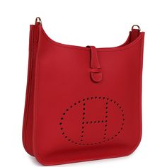 This Evelyne PM is in Vermillon clemence leather with gold hardware, has tonal stitching, pull tab top closure, and Vermillon removable canvas and leather shoulder/crossbody strap.The interior is lined with Vermillion natural leather.Collection: BOrigin: FranceCondition: New and never worn (plastic on hardware)Accompanied by: Hermes box, Hermes dustbag, shoulder strap, shoulder strap dustbag, care booklet and ribbonMeasurements: 11.5" x  12" x 3" ; 18.5" strap drop Hermes Evelyne Iii, Hermes Box, Backpack Tote Bag, Hermes Bags, Pull Tab, Tote Backpack, Handbag Backpack, Crossbody Strap, Natural Leather