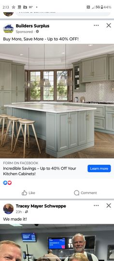 two men are standing in the middle of a kitchen with an island and bar stools