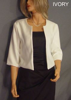 Hip length satin bolero jacket with 3/4 sleeves and scoop neck. Made from high quality bridal satin. Very flattering and comfortable fit. Great for the mother of the bride or anyone looking for a little extra coverage. VIEW PICTURES FOR SIZE AND MEASUREMENT CHART If you are needing more then four of this item just let us know. We are happy to offer VOLUME DISCOUNTS We keep several in each size in stock so that we can ship all orders out ASAP! If you need more then the quantity listed just contac Spring Formal Fitted Shrug, Formal Spring Long Sleeve Shrug, Elegant Satin Outerwear For Wedding, Elegant Stretch Outerwear For Spring, Elegant Satin Wedding Outerwear, Elegant Wedding Satin Outerwear, Fitted Classic Satin Outerwear, Classic Fitted Satin Outerwear, Elegant Long Sleeve Fall Shrug