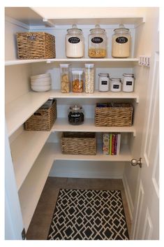 an open pantry with baskets and jars on the shelves next to it is instagramted