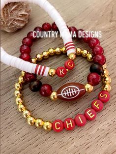 This is an awesome stackable set with strands that have a football accent center, KC lettering and Chiefs lettering. stunning red beads! So comfy Cheap Adjustable Bracelets For Football Season, Football Beaded Bracelets, Red Stacked Beaded Bracelets For Gifts, Red Stacked Beaded Bracelets As Gift, Adjustable Red Bracelets For Sports Events, Red Adjustable Stacked Bracelets, Adjustable Stacked Red Bracelets, Adjustable Red Stacked Beaded Bracelets, Adjustable Stacked Red Beaded Bracelets