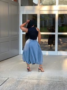 Refine your fashion game with our Mia Denim Culottes. Crafted from soft denim, these culottes feature classic all-over pleating and a wide leg for a chic, sophisticated look. The elastic waistband and side pockets add functionality to these timeless pants. Dress them up with heels or keep it casual with flats or sneakers. One size Measurements guide: waist 25.5 inches-38 inches, hips 59 inches, length 32 inches Please note: Color and hue may vary based on light source and individual monitor sett Casual High Waist Pleated Wide Leg Pants, Versatile Denim Blue Bottoms With Elastic Waistband, Chic Cotton Wide Leg Pants With Pull-on Style, High Waist Pleated Bottoms With Loosely Fitted Hips, Baggy Dark Wash Wide-leg Bottoms, Chic High Waist Pleated Bottoms, High Waist Non-stretch Pleated Skirt Bottoms, High Waist Non-stretch Pleated Skirt, Chic Pleated Wide Leg Bottoms