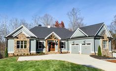 a large house with two car garages on the front