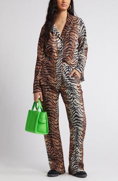 Show off your roaring style in this tiger-striped plissé set that pairs an oversized long-sleeve top with matching flowy pants. Top has front button closure; notched collar; long sleeves Pants have elastic waist; side-seam pockets Partially lined 95% polyester, 5% spandex Hand wash, line dry Imported Striped Long Sleeve Sets For Work, Dressed In Lala, Flowy Pants, Top Pants Set, Tiger Stripes, Notched Collar, Pants Set, Elastic Waist, Long Sleeve Tops