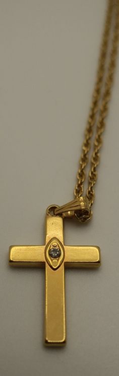 Vintage Avon Gold Tone Cross with clear stone  About 10.5 inches long.  The cross is about 1" long and .5" across.  Preowned. Mesa Az, Clear Stone, Vintage Avon, 1980s Vintage, The Cross, Pendant Necklaces, Favorite Jewelry, Jewelry Necklace Pendant, Gold Tones