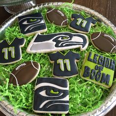 decorated cookies in the shape of football jerseys