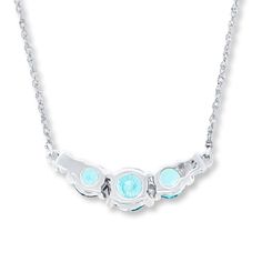 The cool color of three round aquamarines accented by sparkling round diamonds on either side forms the center of this lovely necklace for her. Crafted of 10K white gold, the pendant suspends between a 17-inch Singapore chain that secures with a spring ring clasp. Silver Three Stone Necklace In Fine Jewelry Style, Silver Three Stone Necklace, Fine Jewelry Style, Fine Jewelry Silver Necklace With Three Stones, Necklace For Her, Aquamarine Necklace, Necklace Diamond, Aquamarine Stone, Lovely Necklace, Diamond Stone