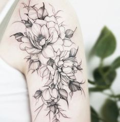 a woman's arm with flowers on it