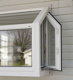 an open window on the side of a house