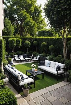 an outdoor living area with black and white furniture