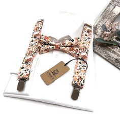 Brunt Orange Floral Suspenders, Rust Orange Bow tie, Suspender Bowtie, Wedding Floral Suspenders, Groomsmen Suspenders, Ring bearer outfit Thank you for choosing [uniqueminashop] for your accessory needs. We appreciate your discerning taste and the opportunity to add a touch of personalization to your style. Need a special color? COLOR: Need a special color? If you have specific colors, patterns you'd like to match, feel free to let me know. Suspender size : ■ BABY SET (6 - 18 mo): ■ BOW TIE - 3 Groomsmen Bow Tie And Suspenders, Two Ring Bearer Ideas, Boho Ring Bearer Outfit, Groomsmen Suspenders And Bowties, Ring Bearer Outfit Suspenders, Floral Suspenders, Ring Bearer Ideas, Suspenders Ring Bearer, Floral Tie Wedding