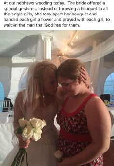 two women are hugging each other in front of a white tent with flowers on it