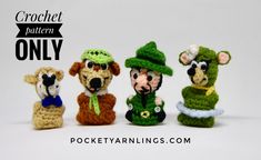 four small crocheted animals wearing hats and scarves