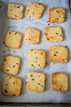 crackers are arranged on a baking sheet and ready to be baked in the oven