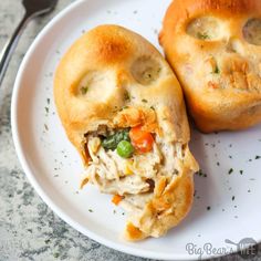 two chicken pot pies on a white plate