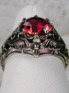 Ruby Ring, sterling silver floral filigree, daisy design #D66 Red Filigree Jewelry For Formal Occasions, Formal Red Filigree Jewelry, Red Ruby Filigree Ring For Wedding, Elegant Silver Ruby Flower Ring, Red Victorian Filigree Ring For Anniversary, Victorian Red Oval Filigree Ring, Victorian Red Sterling Silver Jewelry, Red Victorian Sterling Silver Jewelry, Red Ruby Filigree Ring