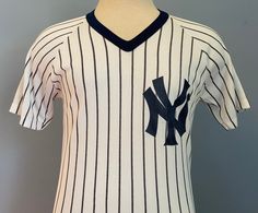 a new york yankees baseball jersey on display