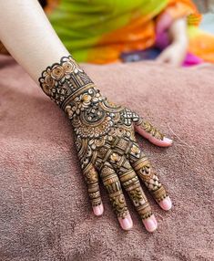 a woman's hand with hennap on top of her arm and hands