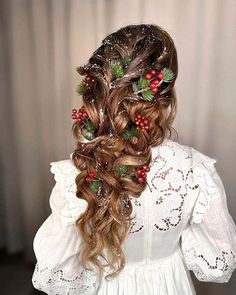 a woman with long hair and christmas decorations on her head, wearing a white dress