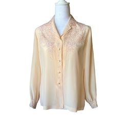 Pink button up long sleeve shirt, is in excellent condition, 100% Silk, hand embroidered. The color is a light pink and has split sides. The size tag is 38 (S) Measurements: Bust: 40" Shoulders: 13" Length: 24" Sleeve length: 22" Cuff: 6.5" Embroidered Long Sleeve Formal Tops, Embroidered Long Sleeve Tops For Formal Occasions, Elegant Long Sleeve Embroidered Shirt, Spring Formal Embroidered Shirt, Feminine Long Sleeve Embroidered Tops, Fitted Long Sleeve Shirt With Embroidery, Fitted Long Sleeve Embroidered Shirt, Fitted Long Sleeve Blouse With Floral Embroidery, Formal Tops With Embroidered Long Sleeves